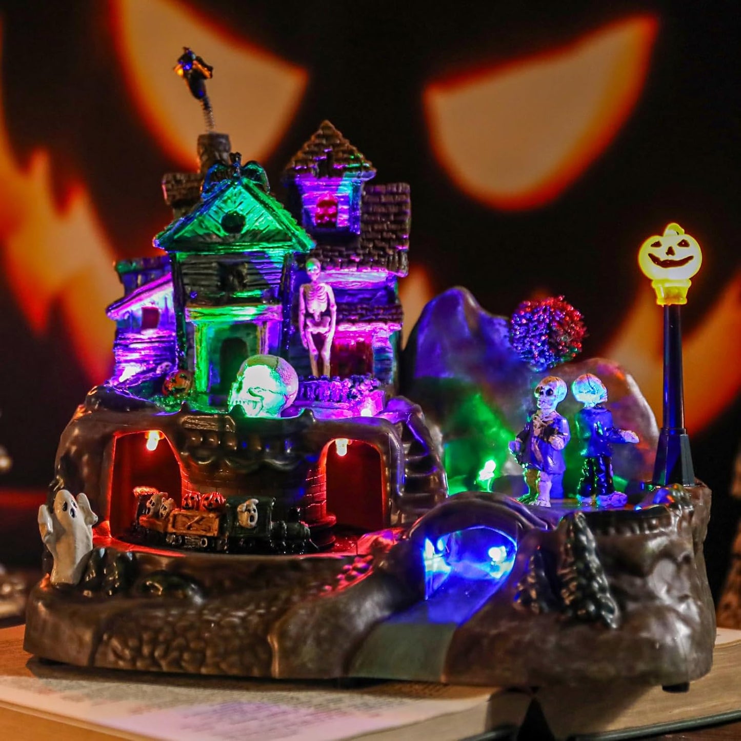 DREAM GARDEN Halloween Village Collection, Lighted Spooky Haunted House with Animated Train and Scary Sound Halloween Collectible Bulidings with Skull, Pumpkin, Ghost for Holiday Party Tabletop Decor