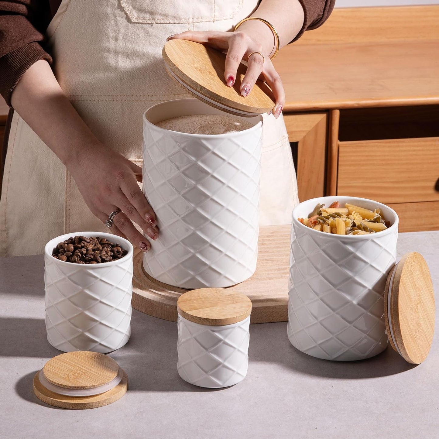 Sweejar Ceramic Canisters Sets for Kitchen Countertop, Relief Food Storage Jar with Bamboo Lid, Stackable Container for Flour, Coffee, Pasta, Cereal, Tea, Cookies, Sugar, Spices, Pack of 4 (White)