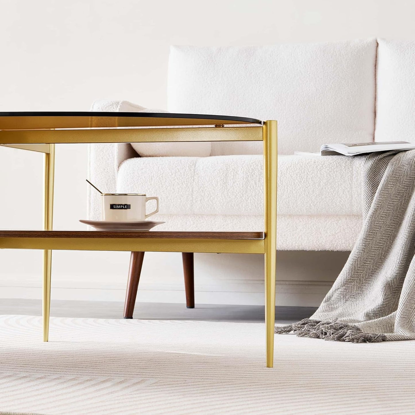 Oval Glass Coffee Table, Mid-Century Modern Design, L43 x W22 x H17 inch, 2-Tier Structure, Olive Shaped Amber Glass Top and Walnut Finish Wood Shelf, Tapered Legs with Gold Finish Frame